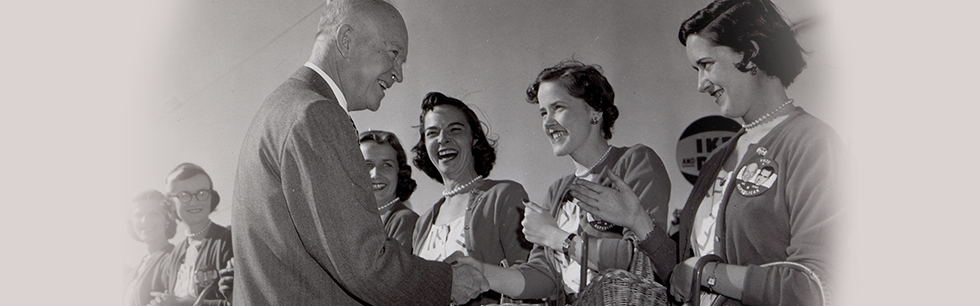 Elsie H. Hillman dressed as an Ike Girl greets President Eisenhower <br>
during a campaign stop in Pittsburgh, 1956. (Copyright: Associated Press)
